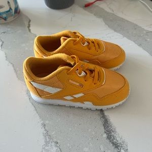 Gold Reebok sneakers